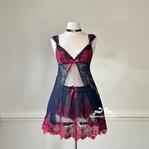 Sultry sheer black meshed slip dress featuring red lace embroidery